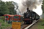 Leider im Gegenlicht: 91 134 der Schweriner Eisenbahnfreunde am 28.08.2010 im Einsatz auf der Strecke Blankenese-Wedel, welche sonst ausschlielich von Zgen der Baureihe 474 (im Bild links) befahren