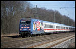 DB 101138-6 mit Zetti Werbung fährt hier am 22.3.2003 um 10.13 Uhr mit einem Intercity Richtung Münster durch den Bahnhof Natrup-Hagen.