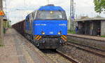 272 010 kommt mit Güterzug aus Richtung Neuss und fährt durch Nievenheim in Richtung Köln.