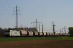 186 149-1 der Captrain mit einem Getreidezug in Neuss-Weienberg am 03.04.2011