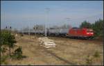 DB Schenker 185 146-8 mit einem Kesselzug am 24.03.2012 in der Berliner Wuhlheide