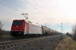 Am 18.01.2014 kam RHC 2066 (185 631-9) mit einem Kesselwagenzug südlich von Buggingen in Nördliche Richtung am Fotografen vorbei.