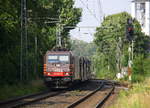 185 601-2 von HSL kommt aus Richtung Mönchengladbach-Hbf,Rheydt-Hbf,Wickrath,Beckrath,Herrath,Erkelenz,Baal,Hückelhoven-Baal,Brachelen,Lindern,Süggerrath mit einem langen Autozug aus Pirna Gbf(D) nach Aachen-West,Zeebrugge(B) und fährt durch Geilenkirchen in Richtung Frelenberg,Zweibrüggen,Übach-Palenberg,Rimburg,Finkenrath,Hofstadt,Herzogenrath, Kohlscheid,Richterich,Laurensberg,Aachen-West. 
Aufgenommen vom Bahnsteig 2 in Geilenkirchen. 
Bei Sommerwetter am Nachmittag vom 22.6.2017.