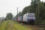 152 134-3 (DB / TFG Transfracht) fhrt am 4. August 2011 um 15:57 Uhr mit einem Gterzug durch Reindorf