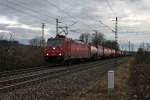 Einfahrt am 14.02.2014 von der Crossrail 185 596-4 mit einem Containerzug in Müllheim (Baden) gen Norden.