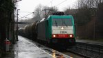 Die Cobra 2804 kommt mit einem gemischten Gterzug aus Antwerpen-Noord(B) nach Kln-Gremberg und fhrt durch Aachen-Eilendorf in Richtung Kln bei Regenwetter am 3.1.2013.