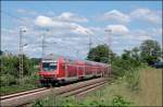RE4 (RE 10423)  WUPPER-Express  fhrt bei sehr warmen Temperaturen am Harkortsee vorbei Richtung Dortmund.