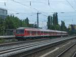 Eine 111 Schiebt am 30.Juli 2012 den RE 79020 von Salzburg nach Mnchen durch den Bahnhof Heimeranplatz Richtung Hauptbahnhof.