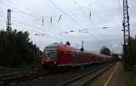 Ein RE4 von Dortmund-Hbf-Aachen-Hbf und am Zugende ist die 111 119 DB kommt die Kohlscheider-Rampe hoch und hält in Kohlscheid und fährt in Richtung Richterich,Laurensberg,Aachen-West.