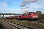 Ausfahrt von der Freiburger 111 050-1 als sie am 09.11.2013 mit RB 26566 (Neuenburg (Baden) - Freiburg (Brsg) Hbf) und dem falschen Bgel aus dem Bahnhof von Mllheim (Baden) fhrt.