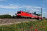 Die 112 133 mit dem RE 18516 von Falkenberg (Elster) nach Stralsund Hbf bei der Fahrt durch Nassenheide am 30.05.2014.