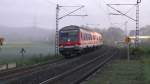 Ein Wittenberger Steuerwagen mit 4 weiteren n-Wagen und einer BR 111 erreichen gerade als RB Saalfeld - Bamberg die Haltestelle Gundelsdorf bei Kronach am frhen morgen des 17.08.2011.