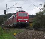 111 057-6 ist am 8. September 2011 mit einem RE nach Mnchen Hbf bei Plling unterwegs.