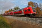 Die 112 114 schiebt am 26.10.2013 den RE 5 von Rostock Hbf nach Lutherstadt Wittenberg durch Nassenheide.