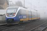 Der Talent VT703 der NordWestBahn beim verlassen des in Nebel gehllten Bahnhof Brackwede in Richtung Mnster am 06.12.2008