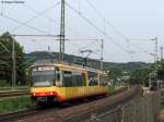 06.05.2011: Wagen 868 verlsst als S5 Eilzug nach Karlsruhe Hbf den Bahnhof Wilferdingen-Singen.