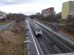 Von der Straßenbrücke Blick,am 14.Februar 2016,auf die Leipziger Station Karlsruher Straße wo gerade 1442 614 nach Militzer Allee einfuhr.