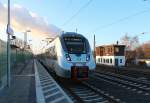 Einfahrt in den Bahnhof Böhlen (b.Leipzig) hat die 1442 700 mit der S4 nach Eilenburg. Im Hintergrund dampft das Kraftwerk Lippendorf. 22.02.2014