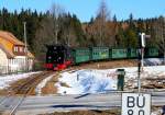 99 785 der Fichtelbergbahn läuft am 26.02.2011 mit ihrem Planzug aus Oberwiesenthal im Bf. Kretscham-Rothensehma ein.