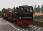 99 6101 whrend des Bahnhoffestes der HSB am 09.06.2012 mit ihrem Foto-Sondergterzug in der Wernigeroder Kirchstrae, auf der Rckfahrt von Hasserode.