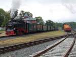 Putbus am 05.Juni 2014 mit der 99 1784 die auf Ausfahrt nach Lauterbach Mole wartete und der abgestellten MTEG 293 022.