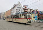 Gelenktriebwagen des Typs G4 aus dem Baujahr 1961 am Vormittag des 04.12.2022 in der Haltestelle Rostock Neuer Markt. 