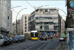 Im dichten Stadtgebiet -    Fleity Tram in Berlin auf der Rosenthaler Straße.