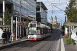 FREIBURG im Breisgau, 20.10.2019, Zug Nr. 247 als Tram2 nach Günterstal in der Haltestelle Stadttheater mit der imposanten Herz-Jesu-Kirche im Hintergrund