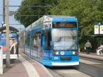 NGT 665 mit Werbung fr 130 Jahre Rostocker Straenbahn an der Hst Steintor.