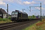 BRLL 185 563-4 verlässt Eitorf mit einem KV-Zug in Richtung Siegburg.