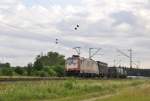 Die nicht gerade saubere 185 599 von CROSSRAIL mit KLV TTS auf der Rheintalbahn bei Waghusel am 9.6.2012