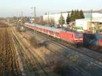 143 972 schiebt am Abend des 22.02.12 eine RB von Basel nach Offenburg in den Bahnhof von Auggen bei Mllheim (Baden).