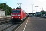 185 023-9 mit dem EZ 44280 von Offenburg nach Mulhouse am Morgen des 25.07.13 bei der Durchfahrt in Mllheim (Baden).