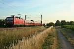 143 050-3 mit einer RB von Freiburg (Breisgau) Hbf nach Neuenburg (Baden) am Morgen des 03.07.14 westlich von Hgelheim.