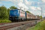 139 287-7  BayernBahn  mit Henkelzug in Thüngersheim, August 2021.