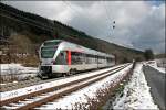 ET23003 bezwingt als ABR99640, (RE16  Ruhr-Sieg-Express ) nach Siegen, die Steigung Richtung Welschen-Ennest. (22.03.2008)