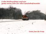 Frohe Weihnachten und ein gutes neues Jahr fr alle Eisenbahnfreunde auf Bahnbilder!! Ein Kf mit eine bergabefahrt zwischen Ochtrup-Brechte und Bad Bentheim am 28-12-2000.