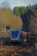 Die Hellertalbahn mit einen ihrer Stadler GTW 2/6 hat am 07.02.2011 (in Betzdorf-Alsdorf) soeben den Alsdorfer-Tunnel verlassen und fhrt weiter Richtung Betzdorf.