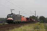 ES 64 U2 - 034 (MRCE) fhrt am 4. August 2011 um 16:32 Uhr mit einem Gterzug durch Reindorf