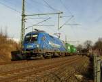 Taurus 182 911-8 der Mittelweserbahn mit Containern in Plauen am 07.03.2015 erwischt.