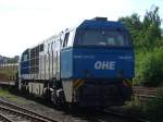 MAK 2000BB der OHE mit einem Holzzug im Bahnhof Arnsberg.