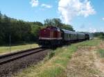 Bei Pastitz war die PRESS 112 565 zusammen mit der 52 8079 mit dem planmäßigen RE von Lauterbach Mole nach Bergen/Rügen,am 15.Juni 2014,unterwegs.