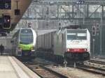 bls / Railpool - Triebzug RABe 515 009 bei Probefahrt  neben der Railpool Lok 186 105  mit der BLS  Lok 485 016 zusammen vor einem einfahrendem Gterzug im Bahnhofsareal in Spiez am 06.04.2013