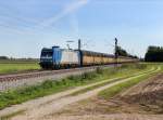 Die 185 514 mit einem Autozug am 16.09.2012 unterwegs bei Langenisarhofen.