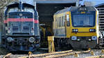 Die Diesellokomotive 211 079-9 und der Ultraschallschienenprüfzug Sperry RailInternational SRS 200 waren auf dem Gelände der Westfälische Lokomotiv Fabrik Karl Reuschling abgestellt. (Hattingen, Februar 2021)