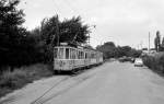 København / Kopenhagen Københavns Sporveje: Der Triebwagen 293 schleppt zwei Beiwagen der Serie 1001 - 1065 zur Verschrottung.