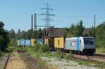 EVB Eisenbahnen und Verkehsbetriebe Elbe Weser GmbH 185 676-4 der EVB zieht einen Containerzug aus Hamburg-Waltershof durch Hamburg-Unterelbe Richtung S�den. Aufgenommen am 07.07.10.