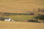 Fichtelbergbahn 99 773 ist am 21.11.09 zwischen Haltepunkt Neudorf und Bahnhof Neudorf unterwegs. 