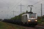 Akiem/HSL 37025 am 20.9.13 mit dem Saarrail Drathrollenleerzug in Ratingen-Lintorf.