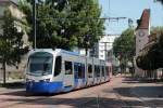 Auf dem Netz der Straßenbahn Mulhouse verkehrt neben den drei innerstädtischen Linien auch der Tram-Train Mulhouse-Vallee de la Thur. Bis Lutterbach fahren die Züge auf der Strecke der Straßenbahnlinie 3, ab dort geht es auf SNCF-Gleisen weiter nach Thann. Der Betrieb erfolgt mit zwölf Siemens Avanto-Triebwagen, die die SNCF als Reihe U 25500 eingereiht hat. Am 19.07.2015 nähert sich ein solcher Zug der Zentralhaltestelle Porte Jeune.